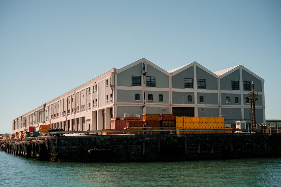 A long warehouse building on a pier at the Cape Town waterfront